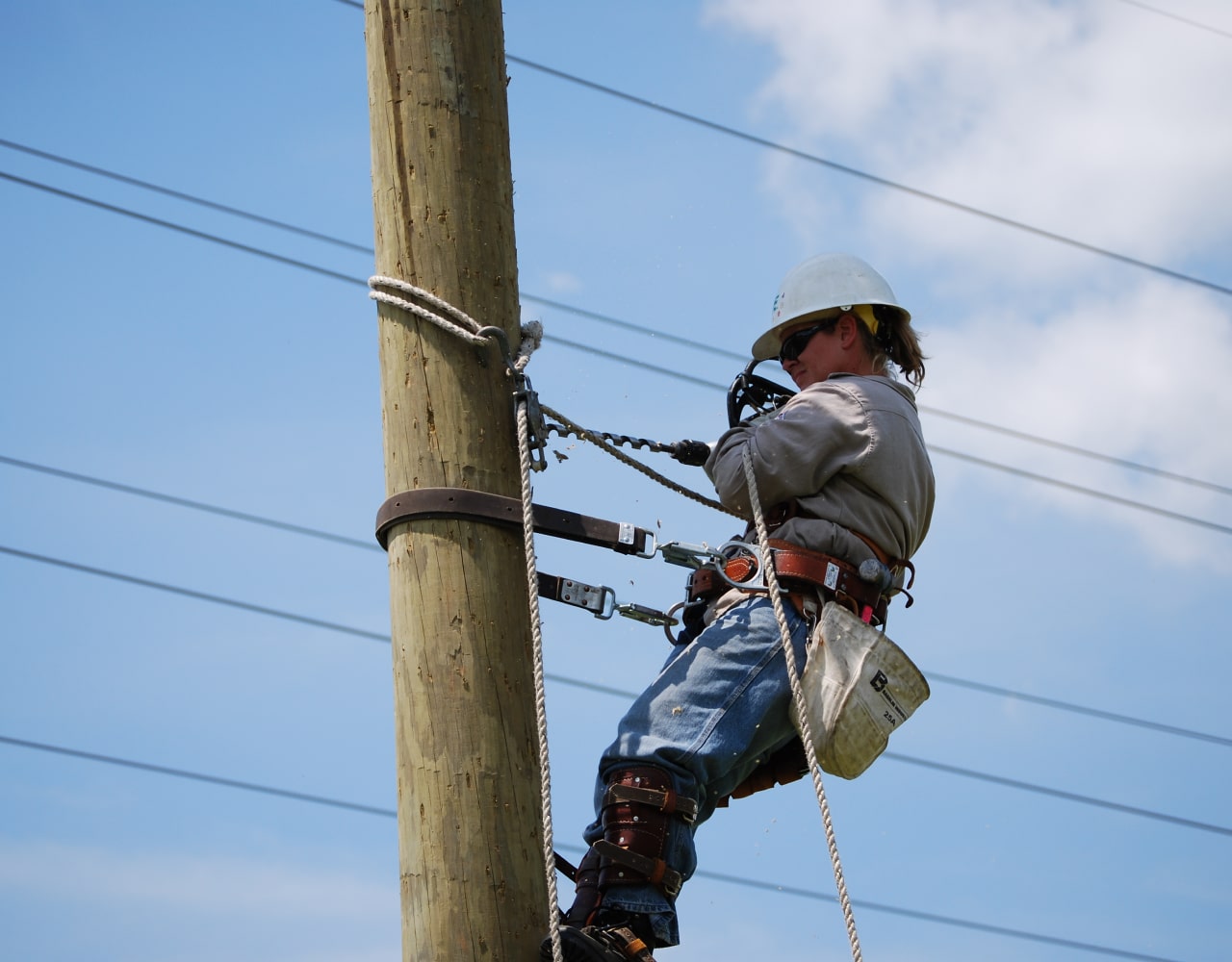 Worker fixing telephone line